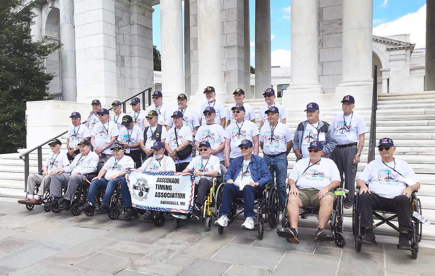The group was photographed on the steps of the World War II memorial during their trip.